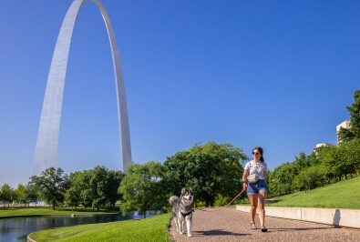 Woman walking dog in Gateway Arch National Park